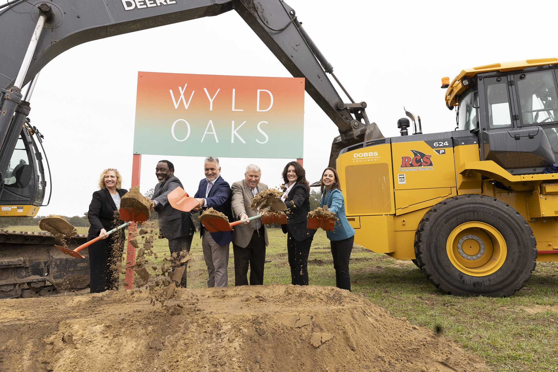 Groundbreaking moment at Wyld Oaks with Cate Manley, Mayor Demings, Mayor Nelson, Joseph Beninati, Michelle Maikisch, and Laureen Martinez