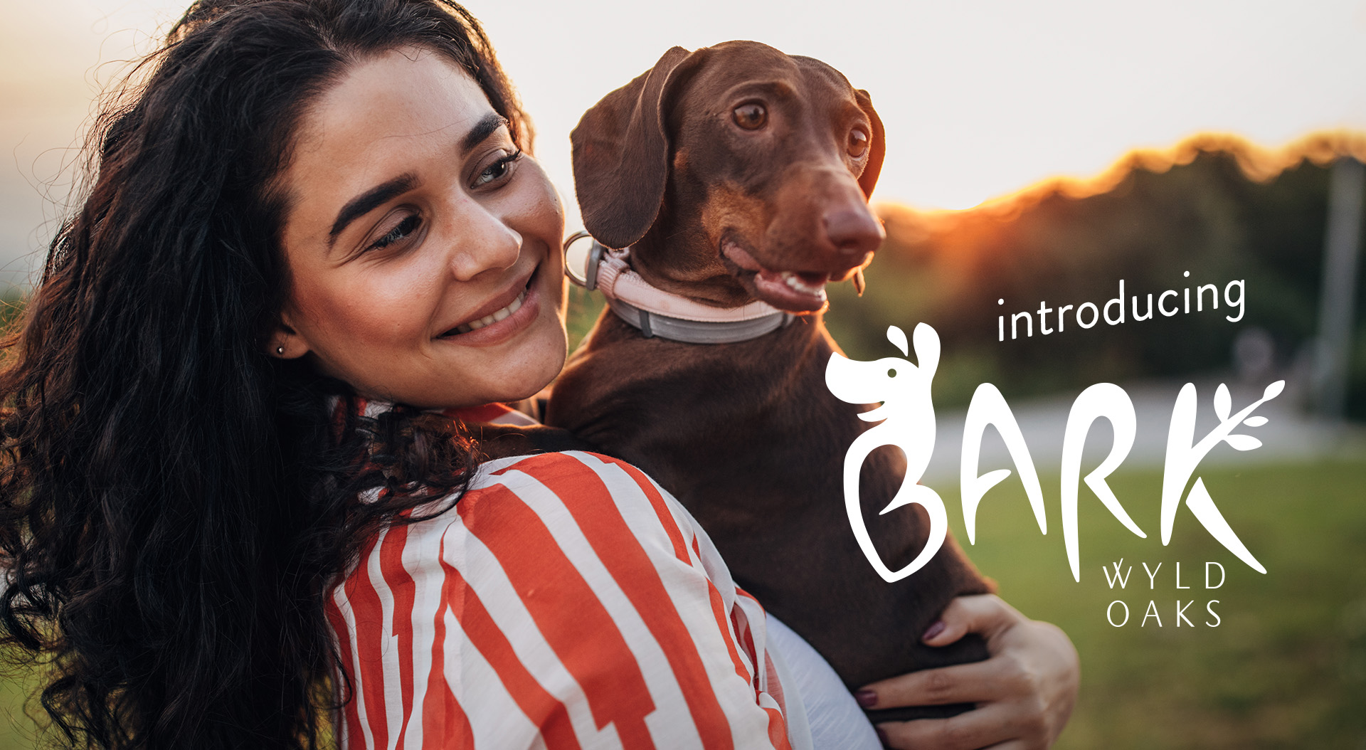 Woman holds dog at BARK, initiative to Design America's Top Dog Park